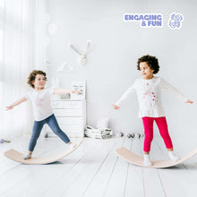 Load image into Gallery viewer, EZPlayToys Wobble Boards in action two young children safely wobbling and balancing