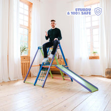 Load image into Gallery viewer, EZPlayToys Panda Playground Toddler Jungle Gym - a young adult sits on the top of the playset demonstrating the sturdiness and safety of the product
